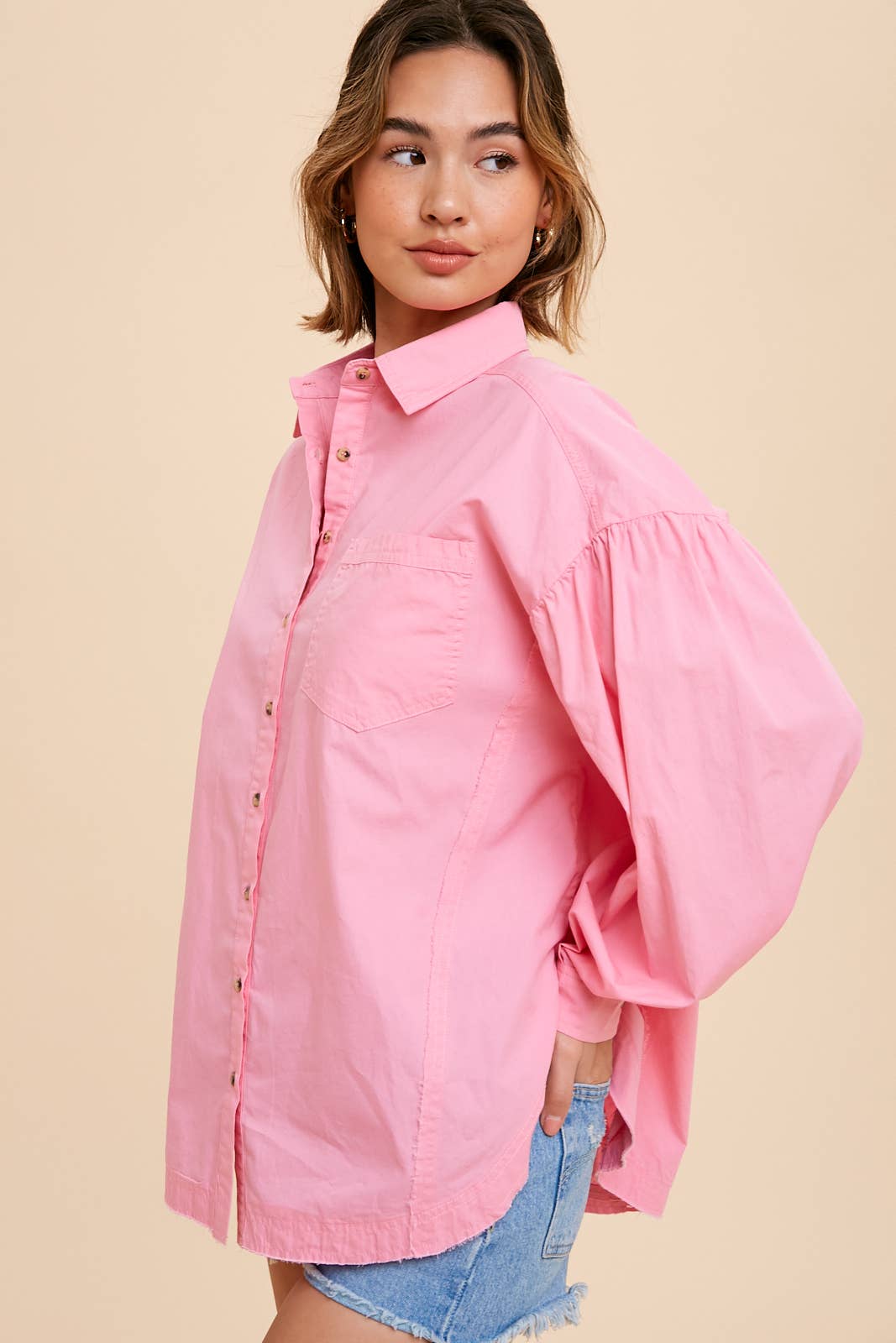 Tina Cotton ShirtIntroducing our Statement Sleeve Poplin Button Down, a versatile addition to your wardrobe. Crafted from a premium cotton blend, this shirt offers a perfect balance of comfort and style. The standout feature of this piece is its statement