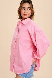 Tina Cotton ShirtIntroducing our Statement Sleeve Poplin Button Down, a versatile addition to your wardrobe. Crafted from a premium cotton blend, this shirt offers a perfect balance of comfort and style. The standout feature of this piece is its statement