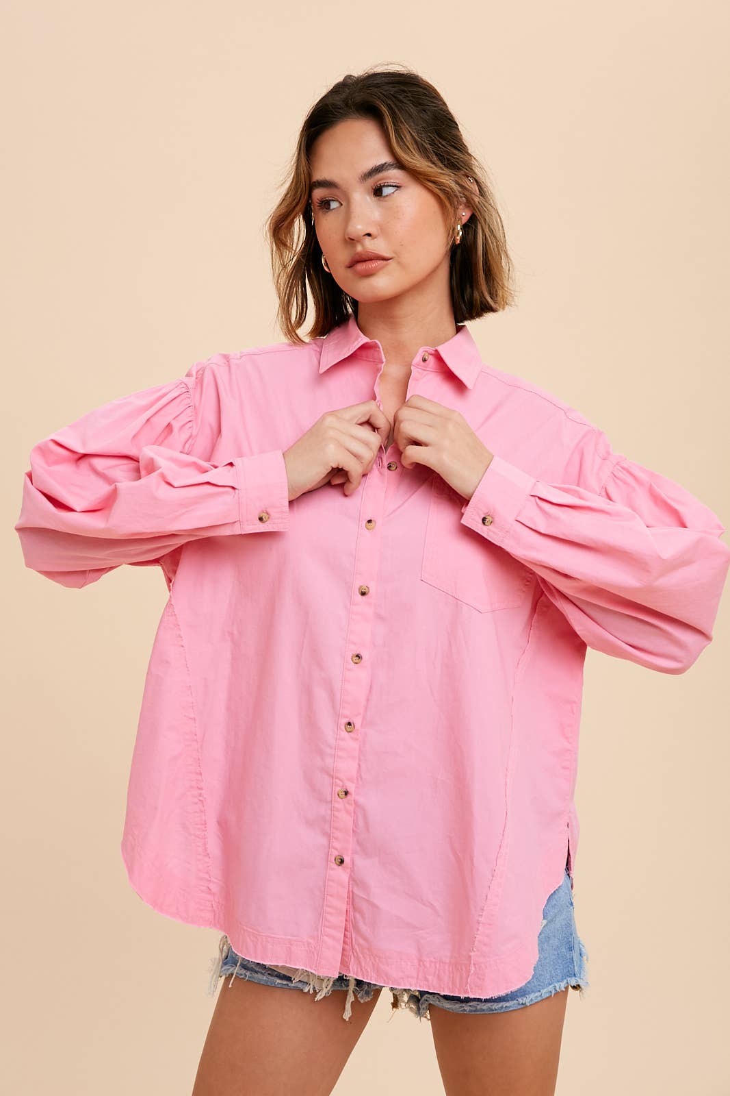 Tina Cotton ShirtIntroducing our Statement Sleeve Poplin Button Down, a versatile addition to your wardrobe. Crafted from a premium cotton blend, this shirt offers a perfect balance of comfort and style. The standout feature of this piece is its statement