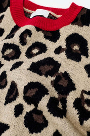 Scarlett Leopard Sweater close-up, featuring soft knit leopard print with vibrant red collar and cuffs.