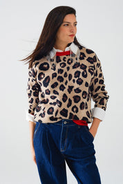 Scarlett Leopard Sweater with vibrant red collar and cuffs, featuring a relaxed fit and stylish leopard print design.