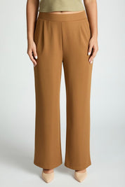 Stylish woman wearing Harbor Waffle Trouser, showcasing comfortable waffle trousers for women in a polished bootcut design.