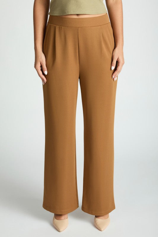 Stylish woman wearing Harbor Waffle Trouser, showcasing comfortable waffle trousers for women in a polished bootcut design.