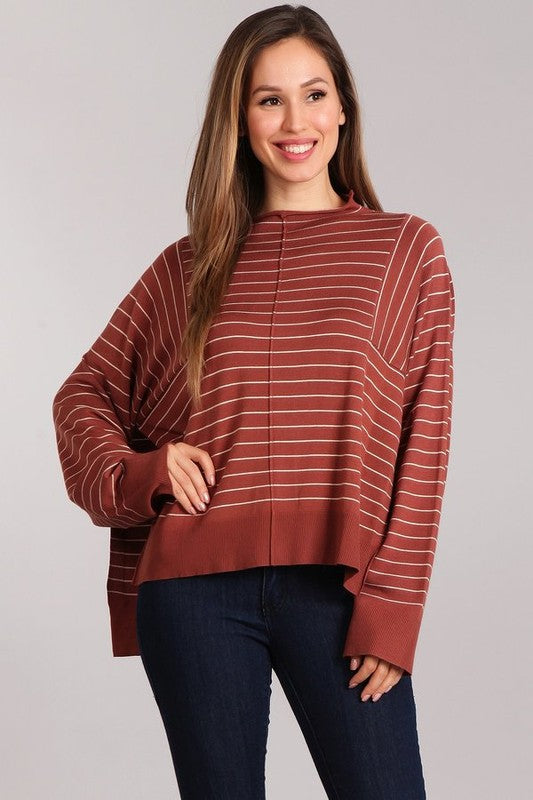 Aubrey Knit Pullover in rust with white stripes, featuring a mock neck and oversized fit, perfect for casual layering.