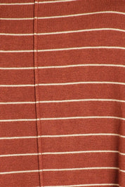 Close-up of aubrey knit pullover fabric, featuring soft, striped design in rust and cream colors.