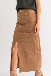 Ginni Midi Skirt - FINAL SALEFeaturing a high rise waist, midi length skirt with front slit. Soft corduroy fabric. SIZE & FIT Fit: This garment fits true to size.Fabric: Non Stretch FabricLength: Size S measures ** MODEL INFO 5'8" & wearing size Small Dis