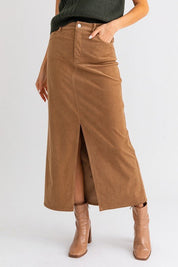 Ginni Midi Skirt - FINAL SALEFeaturing a high rise waist, midi length skirt with front slit. Soft corduroy fabric. SIZE & FIT Fit: This garment fits true to size.Fabric: Non Stretch FabricLength: Size S measures ** MODEL INFO 5'8" & wearing size Small Dis