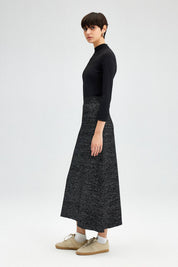 Glitter Maxi Skirt - FINAL SALEAdd a touch of sparkle to your winter wardrobe! This maxi skirt is made of a soft knit fabric, and features an elastic waist SIZE & FIT Fit: This garment fits true to size.Fabric: Stretch FabricLength: Size S measures 37" MO