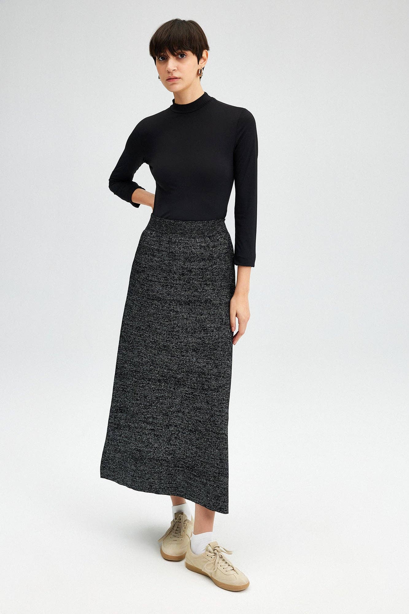 Glitter Maxi Skirt - FINAL SALEAdd a touch of sparkle to your winter wardrobe! This maxi skirt is made of a soft knit fabric, and features an elastic waist SIZE & FIT Fit: This garment fits true to size.Fabric: Stretch FabricLength: Size S measures 37" MO